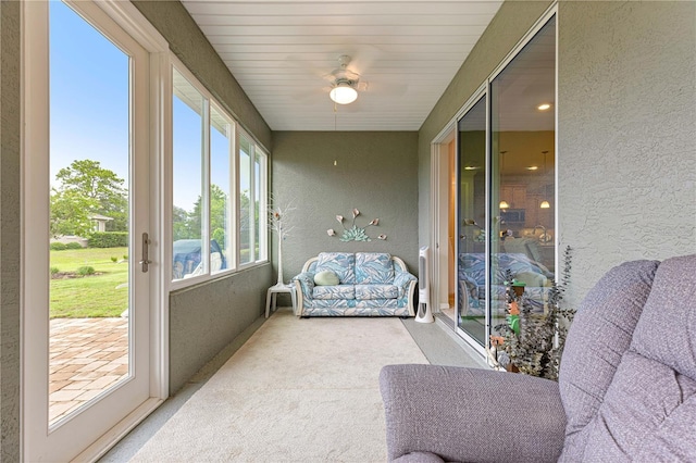 10597 SW 90th Street Rd, Ocala, FL 34481 - sunroom / solarium featuring a textured wall and carpet