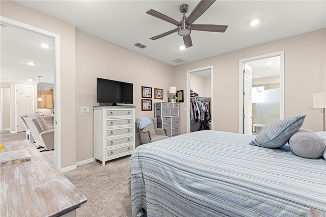 10597 SW 90th Street Rd, Ocala, FL 34481 - bedroom with a spacious closet, light carpet, a closet, recessed lighting, and connected bathroom