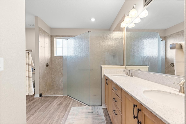 10597 SW 90th Street Rd, Ocala, FL 34481 - full bath featuring wood finished floors, double vanity, and walk in shower