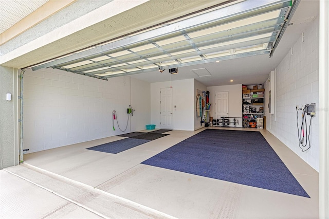 10597 SW 90th Street Rd, Ocala, FL 34481 - garage featuring concrete block wall and a garage door opener