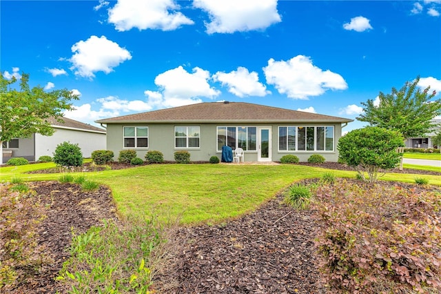 10597 SW 90th Street Rd, Ocala, FL 34481 - back of house featuring a yard and stucco siding