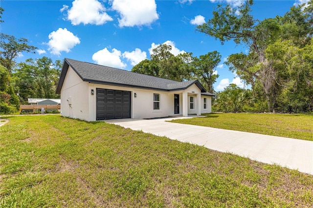 14876 SE 34th Ter, Summerfield, FL 34491 - view of front of property with an attached garage, concrete driveway, stucco siding, and a front yard