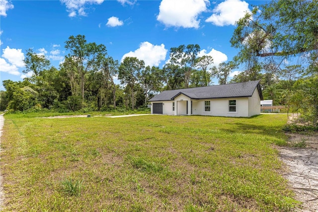 14876 SE 34th Ter, Summerfield, FL 34491 - view of front of home featuring a garage and a front yard