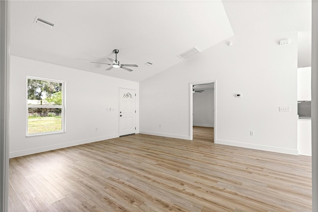 14876 SE 34th Ter, Summerfield, FL 34491 - unfurnished living room with ceiling fan, light wood-type flooring, and high vaulted ceiling