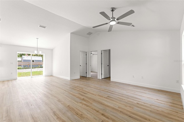 14876 SE 34th Ter, Summerfield, FL 34491 - spare room featuring a ceiling fan, light wood-style flooring, a chandelier, and high vaulted ceiling