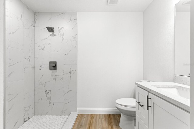 14876 SE 34th Ter, Summerfield, FL 34491 - bathroom featuring a marble finish shower, vanity, and wood finished floors