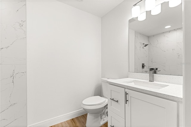14876 SE 34th Ter, Summerfield, FL 34491 - bathroom with wood finished floors, vanity, and a marble finish shower