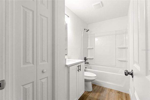 14876 SE 34th Ter, Summerfield, FL 34491 - full bathroom featuring a closet,  shower combination, wood finished floors, and vanity