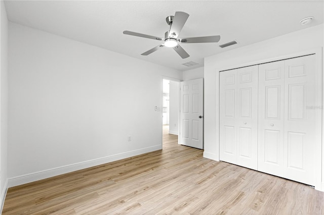 14876 SE 34th Ter, Summerfield, FL 34491 - unfurnished bedroom with light wood-type flooring, a closet, and ceiling fan