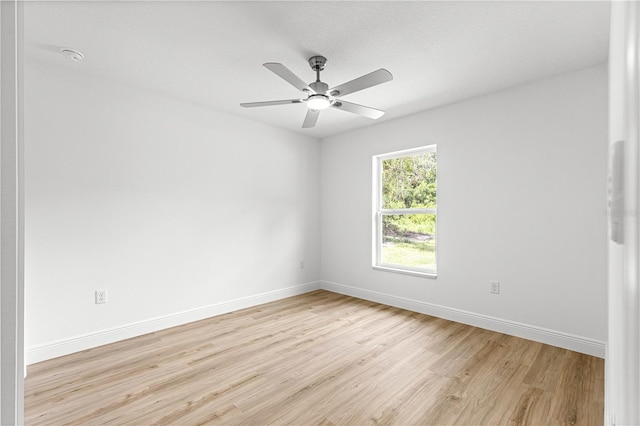 14876 SE 34th Ter, Summerfield, FL 34491 - spare room featuring light wood-style floors and ceiling fan