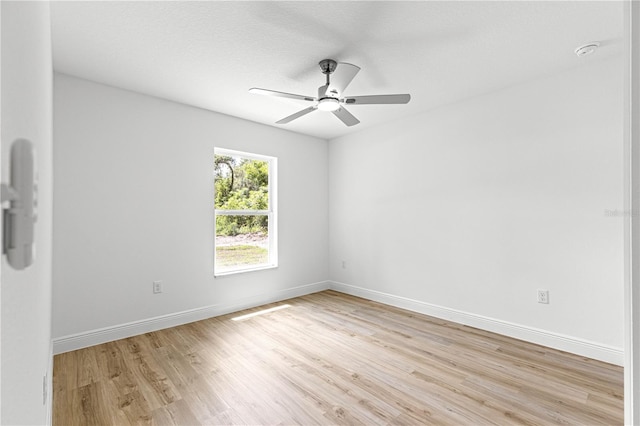 14876 SE 34th Ter, Summerfield, FL 34491 - empty room featuring light wood-type flooring, ceiling fan, and a smoke detector