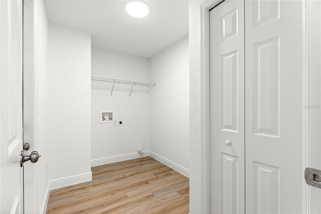 14876 SE 34th Ter, Summerfield, FL 34491 - laundry area featuring light wood-style floors, washer hookup, and electric dryer hookup