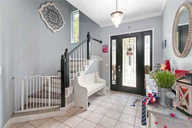 3549 SE 41st Pl, Ocala, FL 34480 - tiled foyer with stairway, ornamental molding, a textured ceiling, and a chandelier