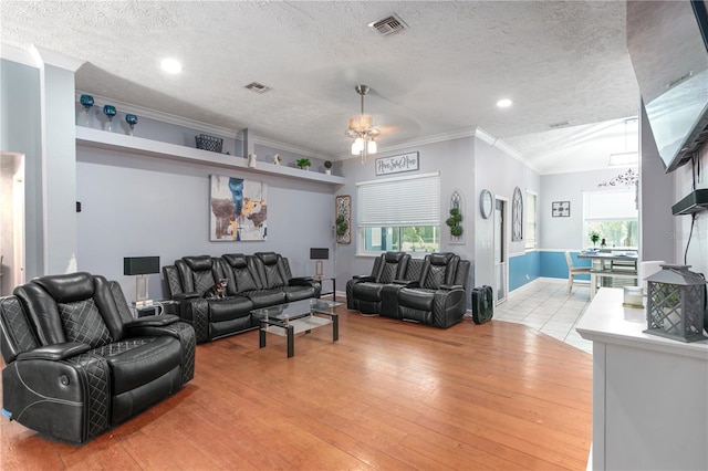 3549 SE 41st Pl, Ocala, FL 34480 - living room with a textured ceiling, ornamental molding, ceiling fan, light wood-type flooring, and recessed lighting