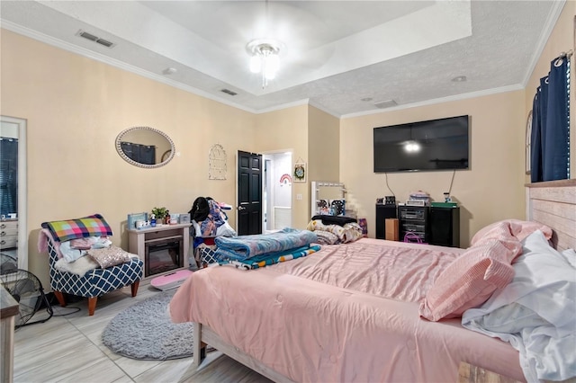3549 SE 41st Pl, Ocala, FL 34480 - bedroom with a tray ceiling, ornamental molding, and tile patterned flooring