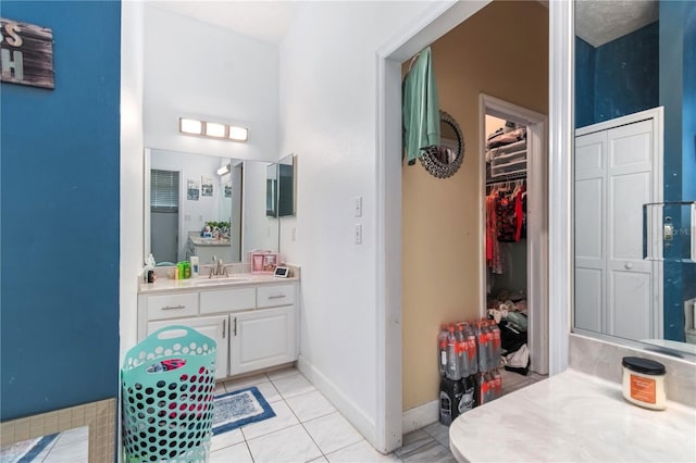 3549 SE 41st Pl, Ocala, FL 34480 - full bathroom with vanity, tile patterned flooring, and a spacious closet