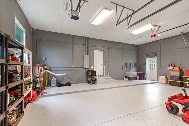 3549 SE 41st Pl, Ocala, FL 34480 - garage featuring a garage door opener and concrete block wall