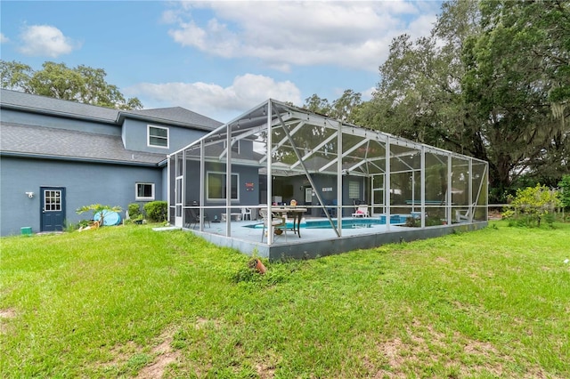 3549 SE 41st Pl, Ocala, FL 34480 - back of house with a lawn, an outdoor pool, a patio area, and stucco siding