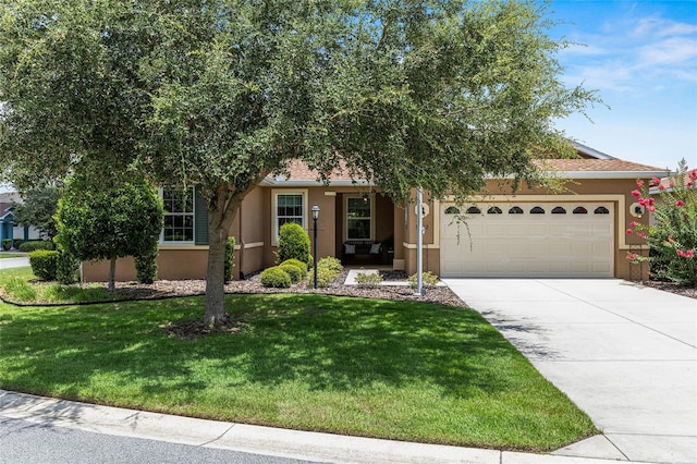 9222 SW 97th Cir, Ocala, FL 34481 - view of property hidden behind natural elements with stucco siding, an attached garage, driveway, and a front yard