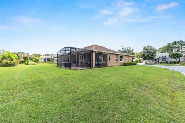 9222 SW 97th Cir, Ocala, FL 34481 - view of grassy yard featuring glass enclosure