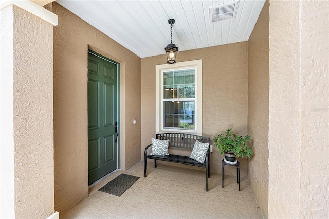 9222 SW 97th Cir, Ocala, FL 34481 - view of exterior entry featuring covered porch and stucco siding