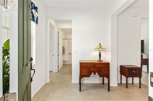 9222 SW 97th Cir, Ocala, FL 34481 - corridor with light tile patterned floors and baseboards