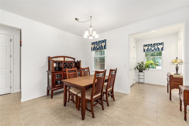 9222 SW 97th Cir, Ocala, FL 34481 - dining space featuring a chandelier and light tile patterned floors