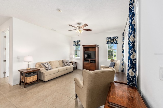 9222 SW 97th Cir, Ocala, FL 34481 - living area with ceiling fan, plenty of natural light, and light tile patterned floors