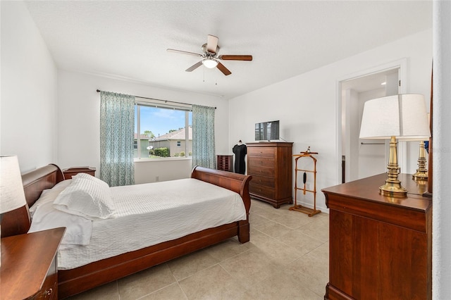 9222 SW 97th Cir, Ocala, FL 34481 - bedroom featuring light tile patterned floors and a ceiling fan