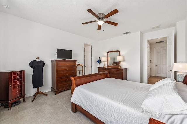 9222 SW 97th Cir, Ocala, FL 34481 - bedroom featuring ceiling fan and light tile patterned floors