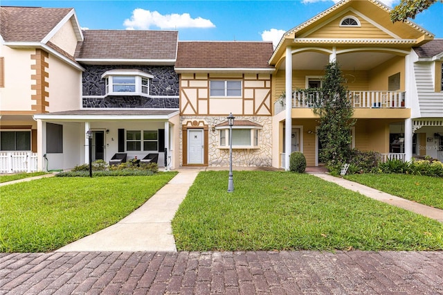 8830 SW 98th Pl Unit M, Ocala, FL 34481 - multi unit property featuring stone siding, a front lawn, and a balcony