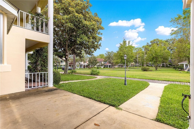 8830 SW 98th Pl Unit M, Ocala, FL 34481 - view of grassy yard featuring a balcony