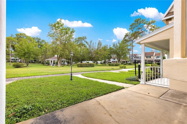 8830 SW 98th Pl Unit M, Ocala, FL 34481 - view of grassy yard featuring a residential view and driveway