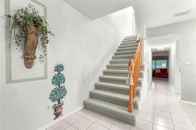 8830 SW 98th Pl Unit M, Ocala, FL 34481 - stairway with a textured ceiling and tile patterned floors