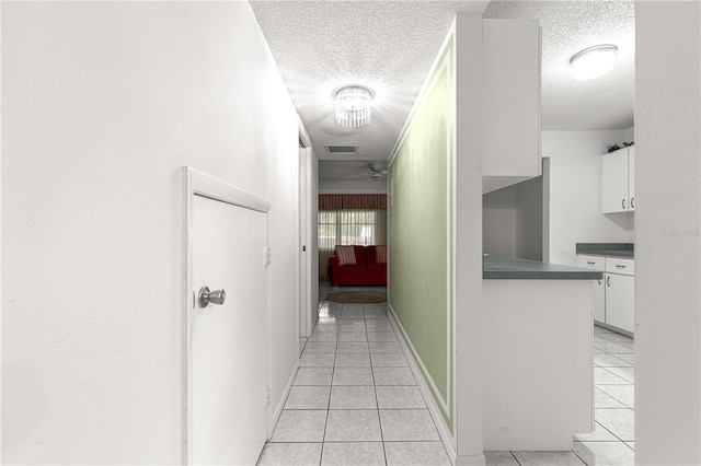 8830 SW 98th Pl Unit M, Ocala, FL 34481 - corridor featuring a textured ceiling and light tile patterned floors