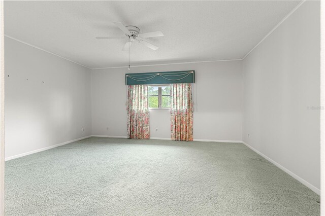 8830 SW 98th Pl Unit M, Ocala, FL 34481 - carpeted spare room with a ceiling fan, a textured ceiling, and ornamental molding