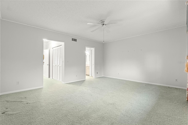 8830 SW 98th Pl Unit M, Ocala, FL 34481 - carpeted spare room featuring a ceiling fan and a textured ceiling