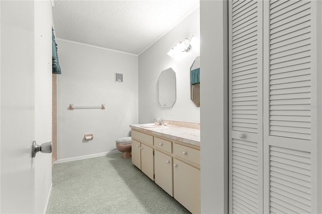 8830 SW 98th Pl Unit M, Ocala, FL 34481 - full bathroom featuring a closet, vanity, crown molding, and a textured ceiling