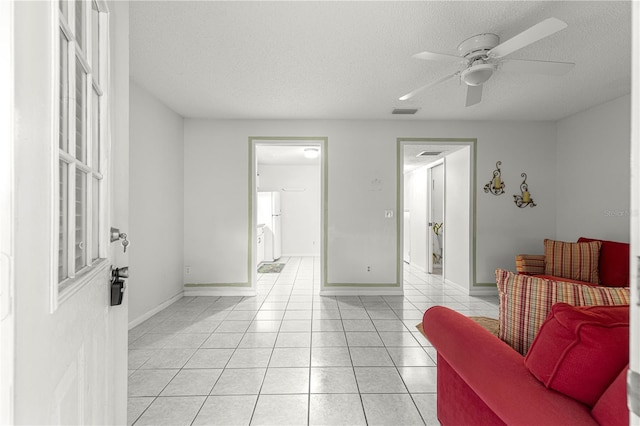 8830 SW 98th Pl Unit M, Ocala, FL 34481 - sitting room featuring light tile patterned floors, a textured ceiling, and a ceiling fan