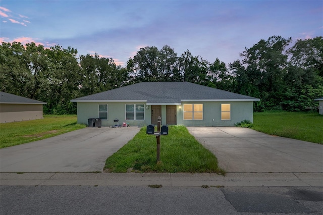 2139 NE 78th Ln, Ocala, FL 34479 - single story home featuring concrete driveway, a yard, stucco siding, and a shingled roof