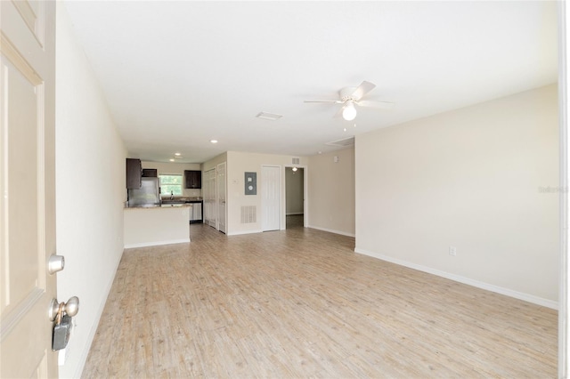 2139 NE 78th Ln, Ocala, FL 34479 - unfurnished living room featuring light wood finished floors, a ceiling fan, and recessed lighting