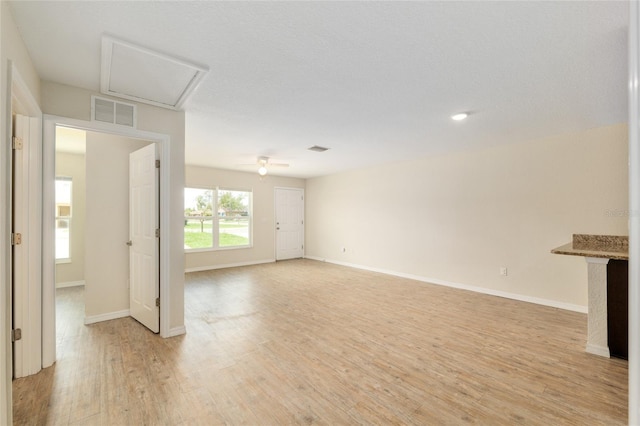 2139 NE 78th Ln, Ocala, FL 34479 - unfurnished living room featuring light wood-style flooring and baseboards