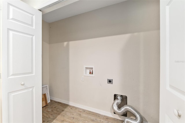 2139 NE 78th Ln, Ocala, FL 34479 - washroom featuring hookup for a washing machine, electric dryer hookup, and light wood-type flooring