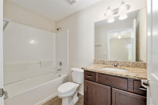 2139 NE 78th Ln, Ocala, FL 34479 - bathroom with vanity, wood finished floors, and shower / bath combination