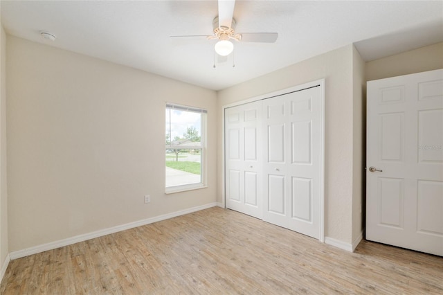 2139 NE 78th Ln, Ocala, FL 34479 - unfurnished bedroom featuring light wood-style flooring, a closet, and ceiling fan