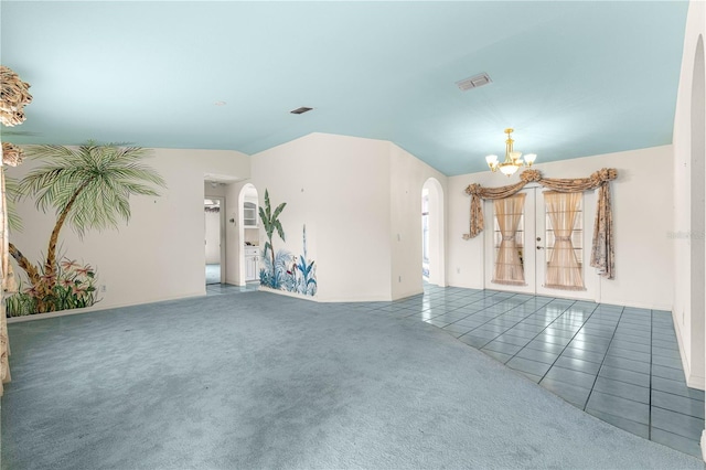 6172 SW 101st Pl, Ocala, FL 34476 - unfurnished living room featuring arched walkways, a chandelier, tile patterned floors, and carpet