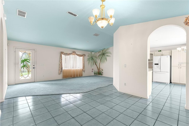 6172 SW 101st Pl, Ocala, FL 34476 - unfurnished room with arched walkways, light colored carpet, a chandelier, and light tile patterned flooring