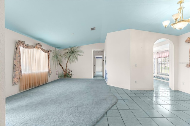 6172 SW 101st Pl, Ocala, FL 34476 - empty room featuring arched walkways, a chandelier, tile patterned flooring, and lofted ceiling