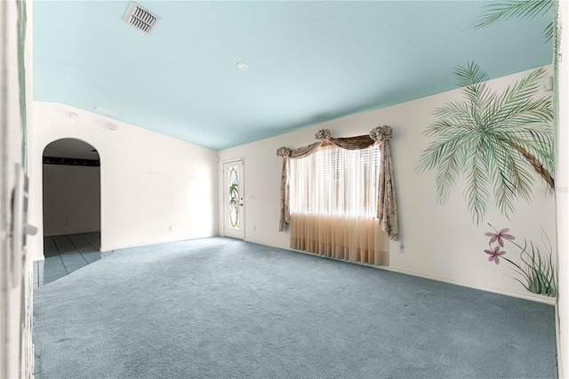 6172 SW 101st Pl, Ocala, FL 34476 - spare room with arched walkways, carpet floors, and vaulted ceiling