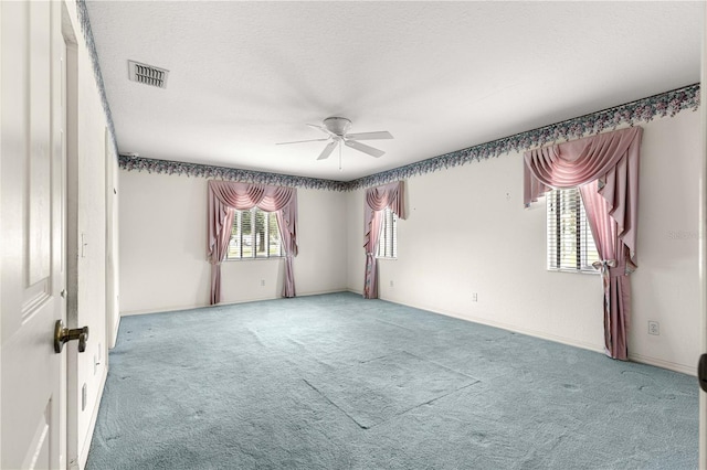 6172 SW 101st Pl, Ocala, FL 34476 - empty room with carpet flooring, ceiling fan, and a textured ceiling
